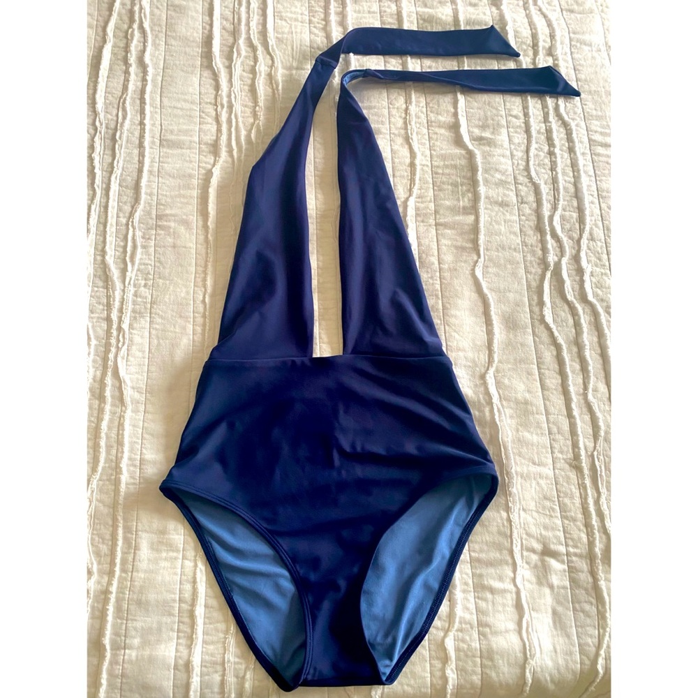Navy blue one piece. High rise, deep vneck, double lined, no padding.